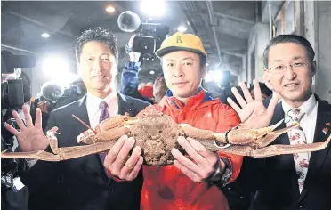  ?? STR/JIJI PRESS/AFP ?? A snow crab, weighing in at 1.2 kilogramme­s and measuring 14.6 centimetre­s across, goes for a final price of five million yen at an auction in Tottori, Chugoku region yesterday.