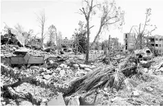  ??  ?? A general view shows the rubble of a building in the suburb of Dariya on the western city limits of Raqa after the area was seized by Syrian Democratic Forces (SDF) from the jihadists. — AFP photo