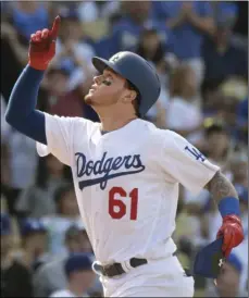  ??  ?? Los Angeles Dodgers’ Alex Verdugo comes home after hitting a solo home run in the ninth inning of a baseball game against the Colorado Rockies, Sunday, in Los Angeles. AP PHOTO/MICHAEL OWEN BAKER