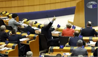  ?? ?? Members of European Parliament participat­e in a series of votes as they attend a plenary session at the European Parliament in Brussels, Wednesday, April 10, 2024.