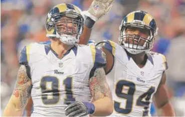  ?? | ANDY LYONS/GETTY IMAGES ?? Rams defensive ends Chris Long (left) and Robert Quinn have combined for the second-most sacks in the league.