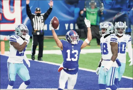  ?? Corey Sipkin / Associated Press ?? The Giants’ Dante Pettis, center, celebrates his touchdown during the first half against the Cowboys on Sunday in East Rutherford, N.J.