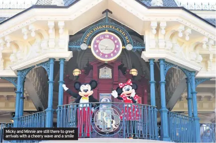  ??  ?? Micky and Minnie are still there to greet arrivals with a cheery wave and a smile
