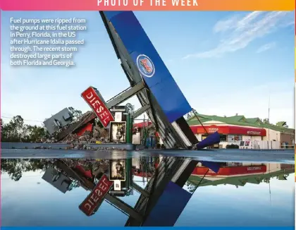  ?? ?? Fuel pumps were ripped from the ground at this fuel station in Perry, Florida, in the US after Hurricane Idalia passed through. The recent storm destroyed large parts of both Florida and Georgia.