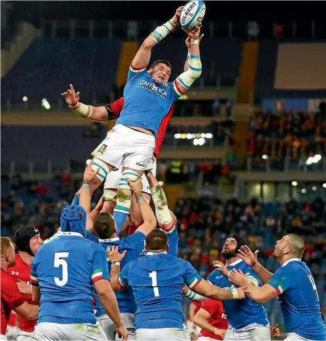  ?? PHOTOS: GETTY IMAGES/AP ?? MAIN: Italy’s Sebastian Negri da Ollegio wins a lineout against Wales.INSET: Scotland’s Rhys Finn Russell is wrapped up by Ireland’s Bundee Aki.