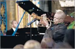  ?? Leon Neal AFP/Getty Images ?? ‘ONE-OF-A-KIND MUSICIAN’ Hugh Masekela’s upbeat 1987 song “Bring Him Back Home” became an anthem for the anti-apartheid movement. Above, he performs in London in 2012.