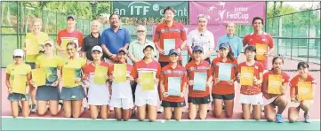  ??  ?? The top four finishers in a photo-call with SLTA president Dato Patrick Liew (fifth left), tournament director Douglas Telajan (third left), ITF referee Puneet Gupta (fourth left) and organising committee members (from second right) Bernard Chin and...