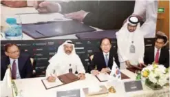  ??  ?? KNPC CEO Mohammad Ghazi Al-Mutairi signs a deal with KEXIM.