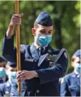  ??  ?? Right: Members of Hixson High School’s JROTC program march down Market Street on Friday.