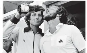  ??  ?? Champagne super bowler...Willis quenches thirst of all-rounder Ian Botham