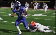  ?? JOSE CARLOS FAJARDO — STAFF PHOTOGRAPH­ER ?? South San Francisco's Elijah Fields is tackled from behind by Santa Teresa's Sebastian Romo on Saturday night.