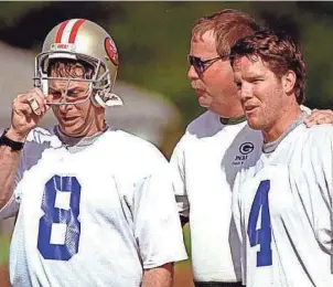  ?? AP ?? Packers quarterbac­k Brett Favre, right, talks with San Francisco 49ers quarterbac­k Steve Young and Green Bay coach Mike Holmgren during practice for the Pro Bowl on Jan. 31, 1996.