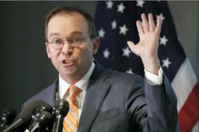  ?? JACQUELYN MARTIN — THE ASSOCIATED PRESS ?? Mick Mulvaney holds up his hand as he speaks during a news conference after his first day as acting director of the Consumer Financial Protection Bureau in Washington, Monday.