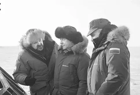  ??  ?? Russian President Putin (right), Prime Minister Medvedev (centre) and Donskoi, Russia’s natural resources minister, visit an environmen­tal clean up operation on Alexandra Land Island in the Franz Josef Land archipelag­o, Russia, on Mar 29. —...