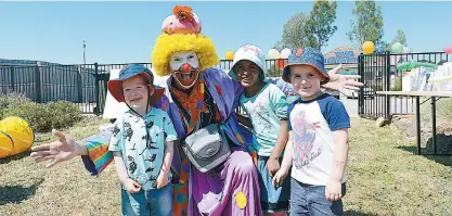  ??  ?? Koko the Clown had plenty of tricks to amuse the children at the Baw Baw Shire Children’s Expo while some including, from left, Harvey Williamson of Buln Buln and Ruth Patchett and Marshall Perkins, both from Warragul, tried a few of their own on Koko.