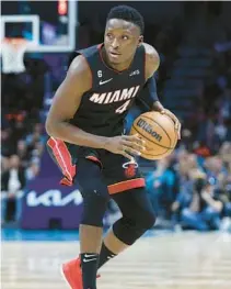  ?? NELL REDMOND/AP ?? Heat guard Victor Oladipo brings the ball up court against the Hornets during the second half Jan. 29 in Charlotte, N.C.