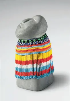  ??  ?? Eva Talooki Aliktiluk (1927-1994 Arviat) Woman c. 1980 Stone, glass beads and thread 20 x 11.5 x 11 cm Courtesy Walker’s Auctions, Ottawa Photo Dieter Hessel Opposite:
Lucy Tasseor Tutsweetok (1934-2012 Arviat) Family Group 1988 Stone 44 x 32 x 19 cm...