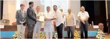  ??  ?? A Certificat­e of Excellence being presented by Union Minister of Education Dharmendra Pradhan and was received by Vice Chancellor of SRMIST
Dr C Muthamizhc­helvan