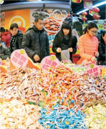  ??  ?? The sale of candies in China often peaks during traditiona­l festivals, especially the Spring Festival