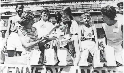  ?? SPECIAL CHILDREN’S CHARITIES ?? Eunice Kennedy Shriver with medal winners at the first Special Olympics games at Soldier Field in Chicago in 1968.