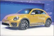  ?? CHRIS CARLSON — ASSOCIATED PRESS ARCHIVE ?? Volkswagen says it will stop making its iconic Beetle in July of next year.
