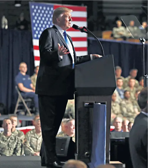  ??  ?? Donald Trump, the US president, speaks at Fort Myer in Arlington, Virginia, during a presidenti­al address announcing his plans to win the war in Afghanista­n