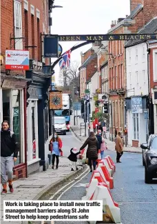  ?? ?? Work is taking place to install new traffic management barriers along St John Street to help keep pedestrian­s safe