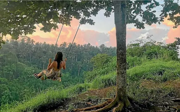  ?? KATIE HOGBERG ?? ‘‘My friend took this photo of me admiring the sunrise in Bali.’’ says Karri Shaw. ‘‘The Campuhan Ridge Walk is an easy 20-30-minute hike that is frequently traversed by travellers and those out for their morning run. It’s so serene, you wouldn’t...