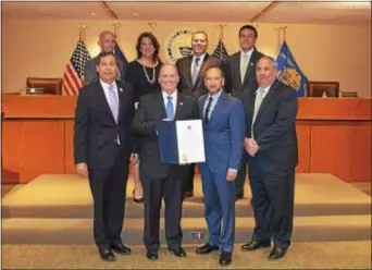 ??  ?? Delaware County Council recognized the work of Operation First Response in advance of its 11th annual Walk for Wounded and Warriors Run. Pictured in front are Marty Milligan, Destinatio­n Delco; council Chairman John P. McBlain; walk organizer Nick...