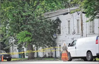  ?? MARSHALL GORBY / STAFF ?? After part of the first floor of the structure at 216 E. Main St. in Tipp City fell into the basement, a safe zone was set up and Main Street was closed from downtown to Ohio 202.