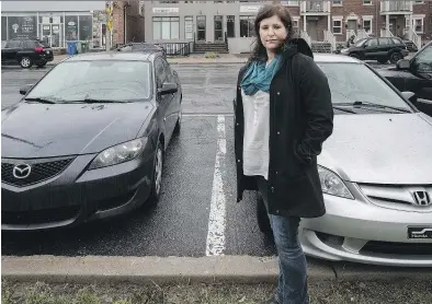  ?? DAVE SIDAWAY ?? A bike path is being installed on the west side of Cartier Ave. in Pointe-Claire. Business owner Chantal Guy sees this as an opportunit­y to address long-standing parking issues in the area.