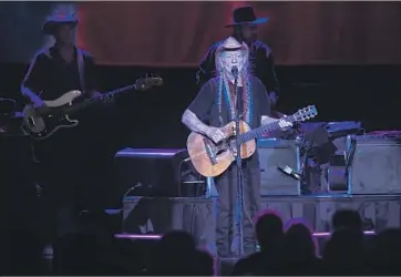  ?? Wally Skalij Los Angeles Times ?? WILLIE NELSON injects slippery rhythms and phrasing into Thursday’s concert at the Shrine Auditorium.