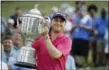  ?? CHRIS O’MEARA — THE ASSOCIATED PRESS ?? Justin Thomas poses with the Wanamaker Trophy after winning the PGA Championsh­ip Sunday in Charlotte, N.C.