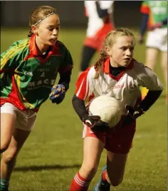  ??  ?? Saoirse McDonald of Kilanerin moves away from Emma Rossiter.