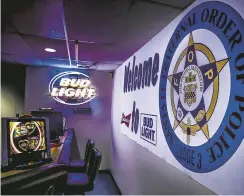  ?? GABRIELA CAMPOS/NEW MEXICAN FILE PHOTO ?? The Fraternal Order of Police’s lodge — which has a bar, pool tables and slot machines, in addition to a spacious event hall — is set to go to auction.