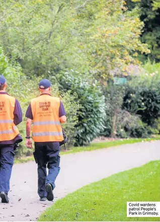  ??  ?? Covid wardens patrol People’s Park in Grimsby.