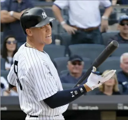  ?? BILL KOSTROUN / THE ASSOCIATED PRESS ?? New York Yankees pinch hitter Aaron Judge reacts after striking out during the ninth inning in the first game against the Cleveland Indians Wednesday at Yankee Stadium. The Yankees were swept by the Indians.