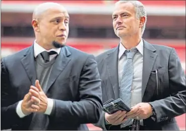  ??  ?? Former Chelsea manager Jose Mourinho (right) with former Brazilian player Roberto Carlos during the FIFA Presidenti­al elections recently. The latest whispered talk is that Mourinho will take over if United fail to make the Champions League next...