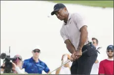  ?? (AP/Fernando Liano) ?? Tiger Woods, playing his first profession­al golf in eight months after undergoing ankle surgery, shot a 3-over 75 on Thursday at the Hero World Challenge in the Bahamas.