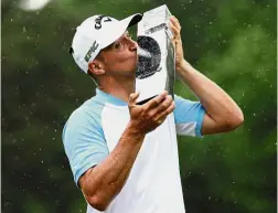  ?? — Reuters ?? Worth the wait: Alex Noren kissing his trophy after winning the European PGA Championsh­ip in Wentworth, England, on Sunday.
