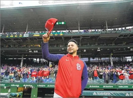  ?? CHARLES REX ARBOGAST AP ?? The Cardinals’ Willson Contreras acknowledg­es crowd at Wrigley Field on Monday, his first appearance there since he left as a free agent.