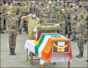  ??  ?? Army officials pay tributes to SFF commando Nyima Tenzin during a wreath-laying ceremony in Leh on Monday. Senior BJP leader Ram Madhav was also present at the funeral.