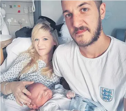  ??  ?? > Chris Gard and Connie Yates with their son Charlie Gard