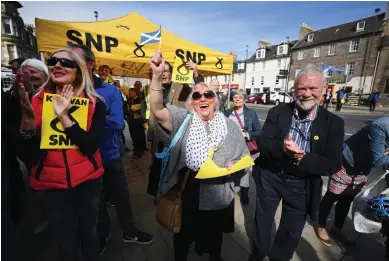  ?? Photograph: Jeff J Mitchell/Getty Images ?? SNP supporters await the arrival of Nicola Sturgeon as she campaigns with the candidate for East Lothian, George Kerevan