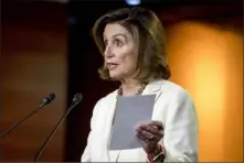  ?? Andrew Harnik/ Associated Press ?? House Speaker Nancy Pelosi, D- Calif., meets with reporters Thursday on Capitol Hill.