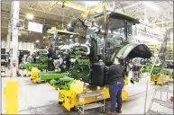  ?? Associated Press ?? People work at the John Deere Commercial Products factory in Grovetown, Ga.