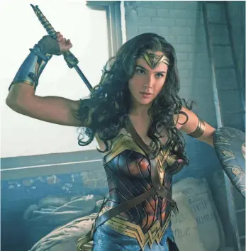  ?? CLAY ENOS, DC COMICS ?? Gal Gadot as Wonder Woman is promoting protein bar brand ThinkThin, among other items.