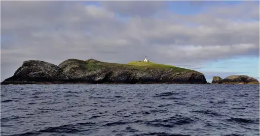  ??  ?? ABOVE: The Flannan Isles lighthouse, from which three men vanished in 1900. BELOW: The story was retold and embellishe­d in the August 1929 issue of True Strange Stories.