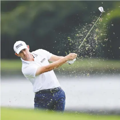  ?? SAM GREENWOOD/GETTY IMAGES ?? Patrick Cantlay plays a shot Friday during the second round of the Fedex Cup at East Lake Golf Club in Atlanta. He finished the day with a bogey-free 4-under par. The American is at -17 for the two days, good for a slim lead over world No. 1 Jon Rahm of Spain.