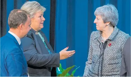  ??  ?? Norway Prime Minister Erna Solberg in talks with Theresa May at an internatio­nal summit in Oslo yesterday